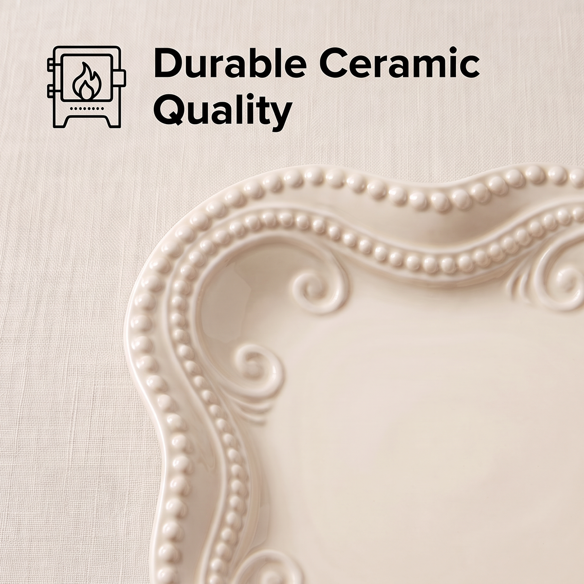 Close-up of the ivory platter’s raised scrollwork and beaded rim