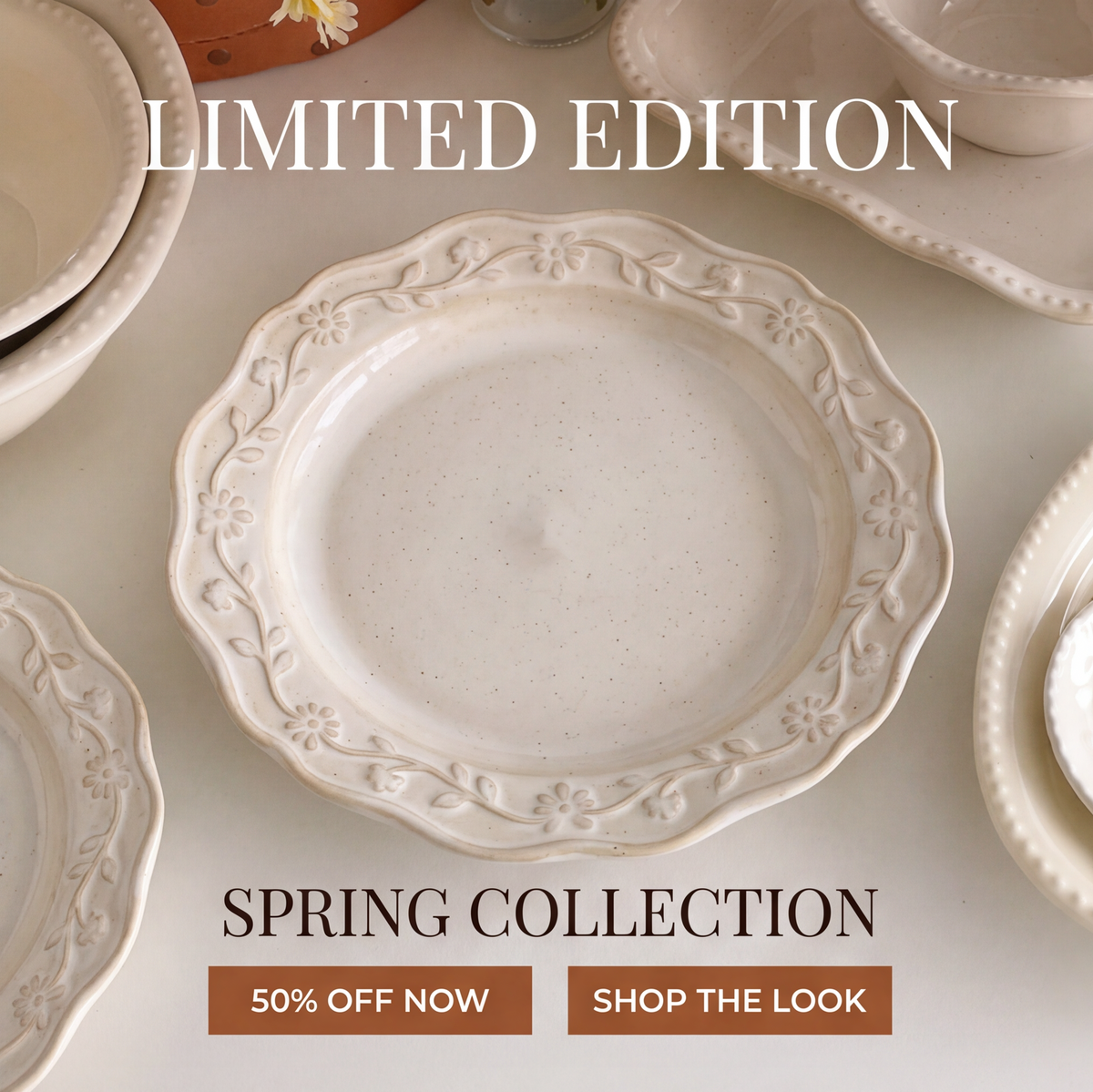 SERVICE ivory stoneware dinner plate with scalloped floral relief rim and speckled center, angled view