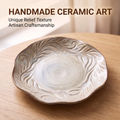 SERVICE ceramic dinner plate with swirling raised relief and speckled pale center, top view