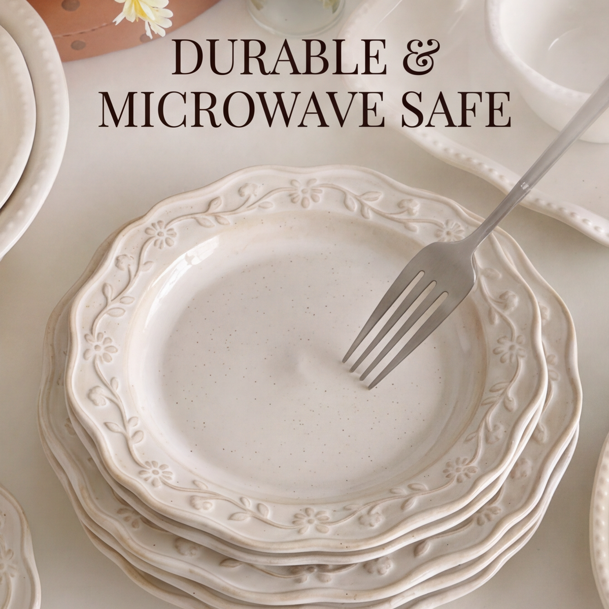 Stack of floral relief stoneware dinner plates with microwave-safe text overlay