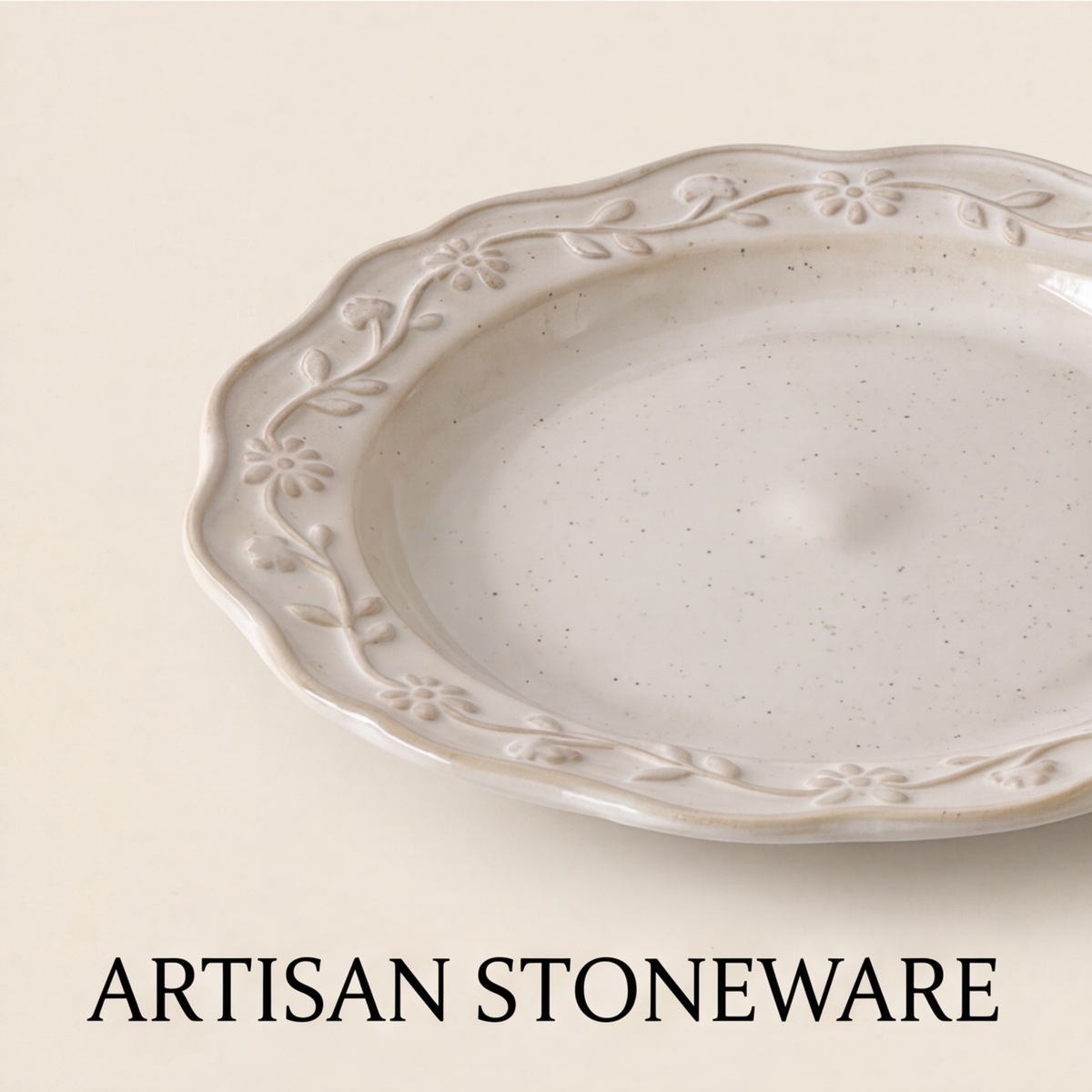 Ivory floral relief dinner plate in an elegant table setting with cutlery