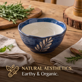 Blue ceramic bowl with hand-painted leaf motif and limited-offer promotional text