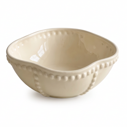 SERVICE ivory ceramic serving bowl with wavy rounded-square rim and raised beaded trim on white background