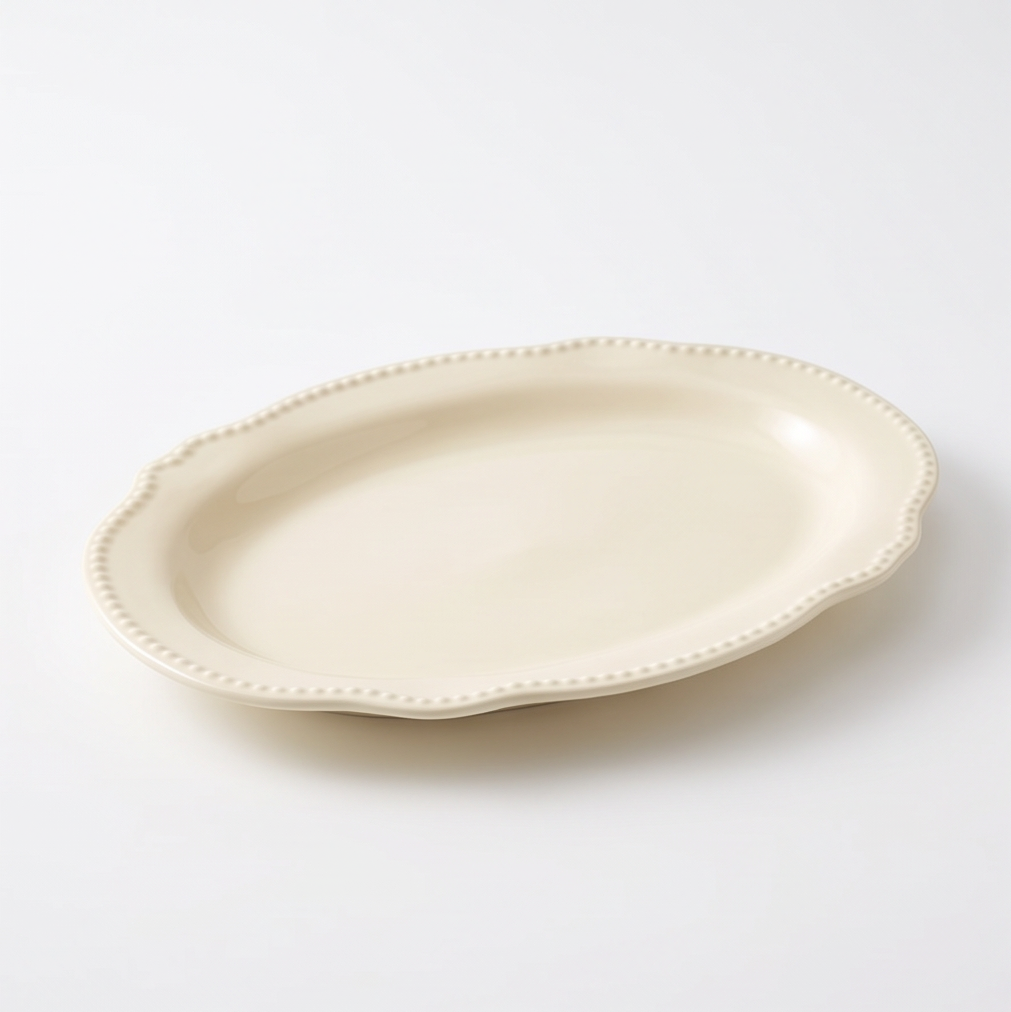 Close-up of the ivory ceramic platter's raised beaded rim