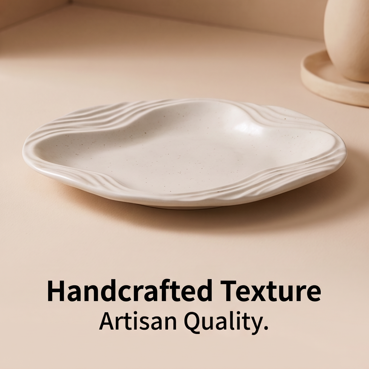 Ivory porcelain serving plate with organic wavy rim and sculpted ridges, angled product view