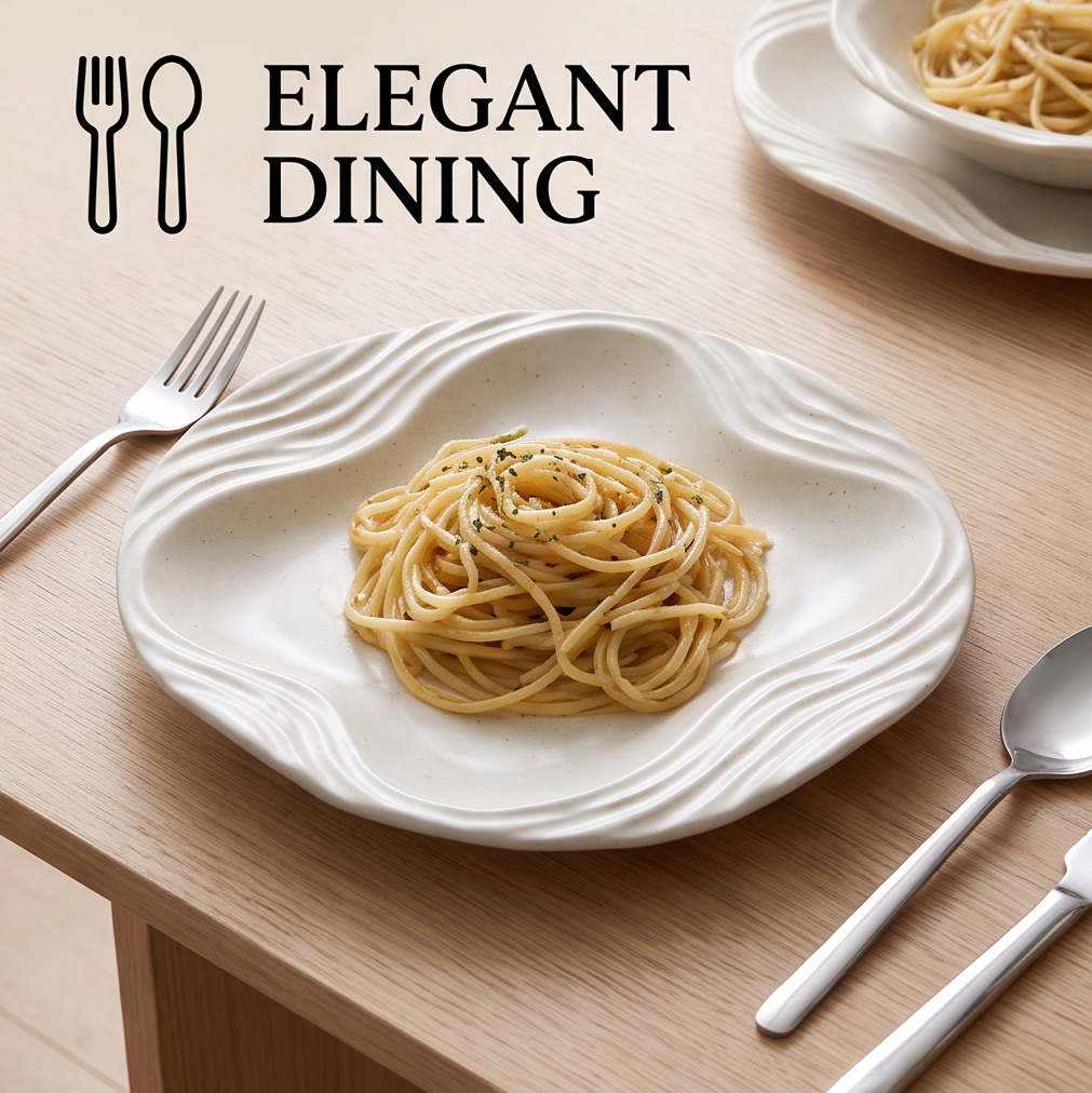 Pasta served on the ivory organic wave porcelain plate with elegant cutlery