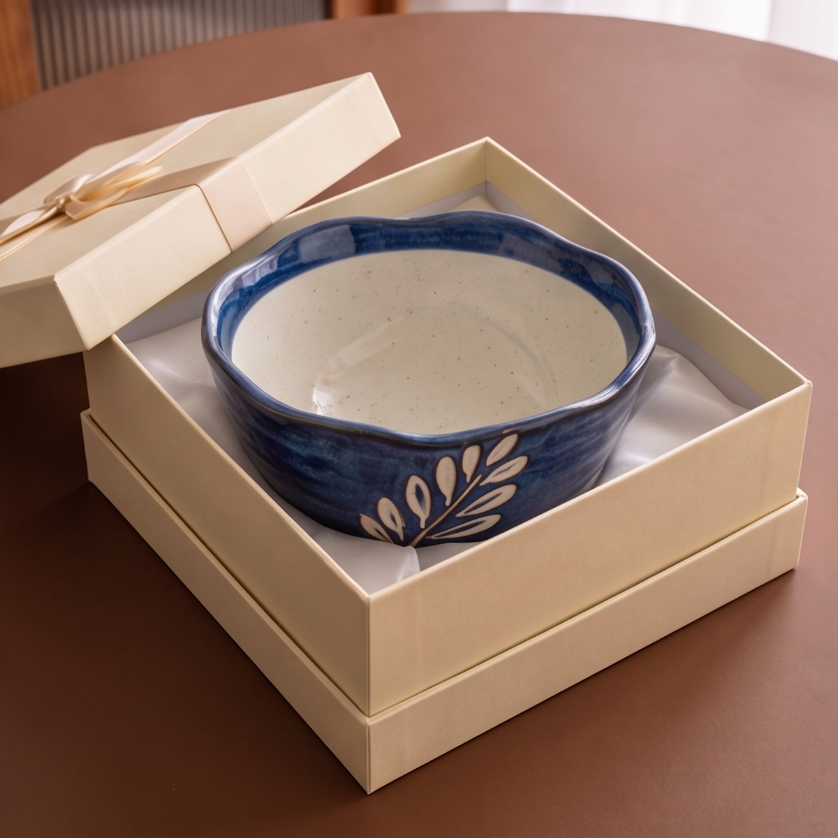 Blue leaf ceramic bowl photographed in a dishwasher rack with dishwasher-safe text