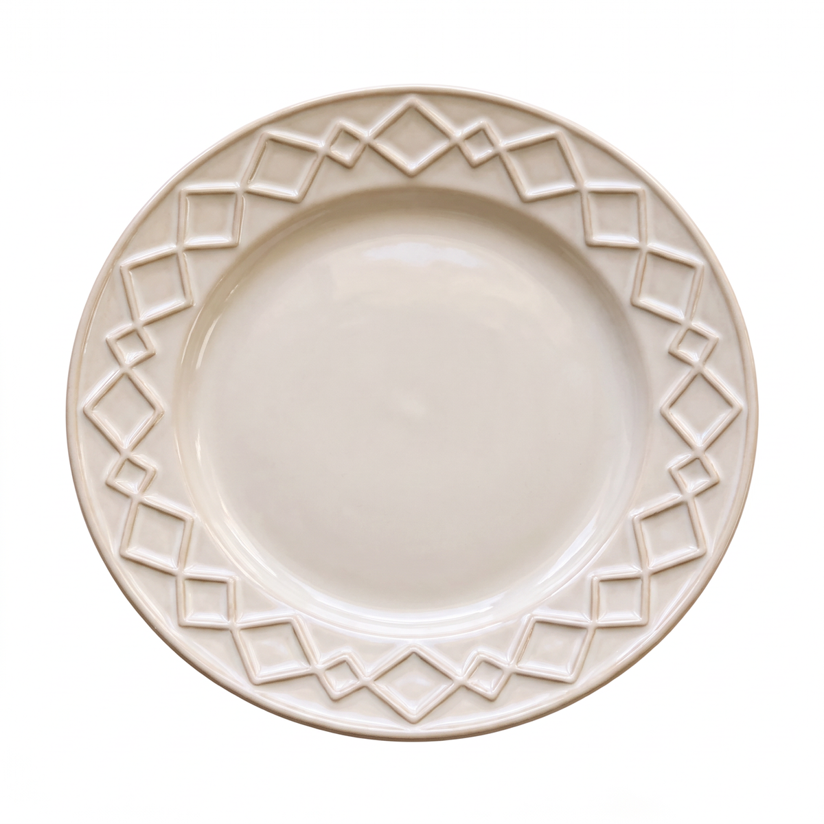 Cream serving plate with a raised geometric relief border, top-down view on a light background