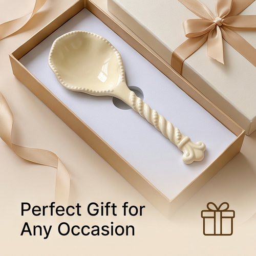 Cream ceramic spoon with twisted handle displayed in a ribboned gift box